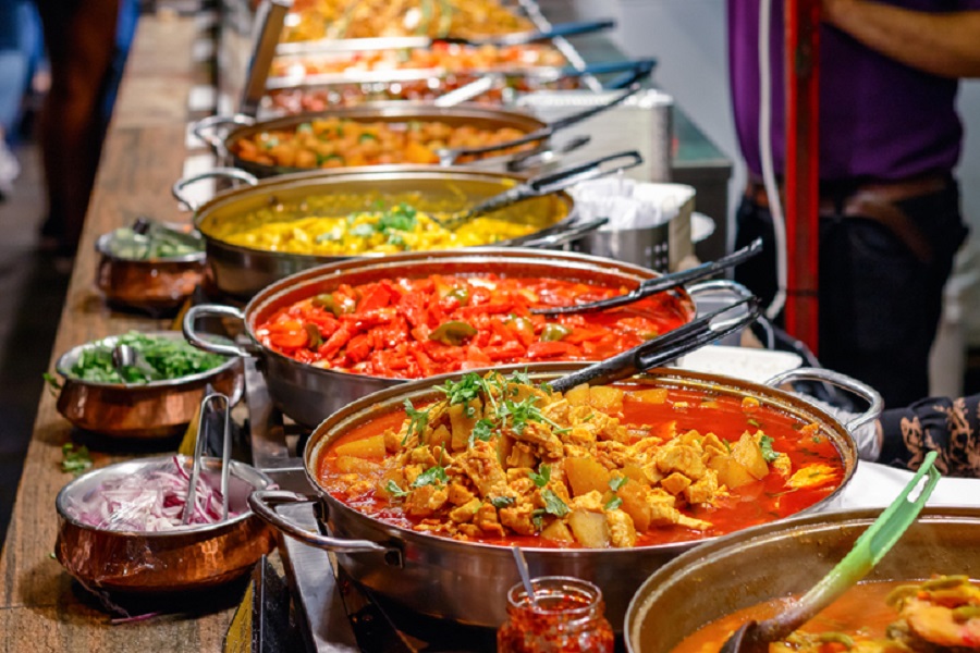 Cooked curries on display at Camden Market in London - Clay Oven Indian  Resturant